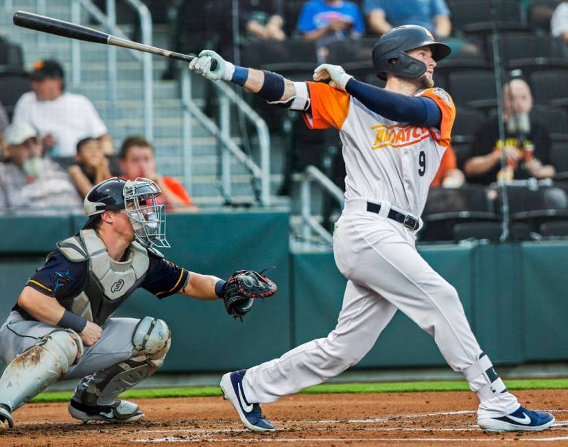 Las Vegas Aviators first baseman Seth Brown (9) hits a single in the bottom of the first inning ...