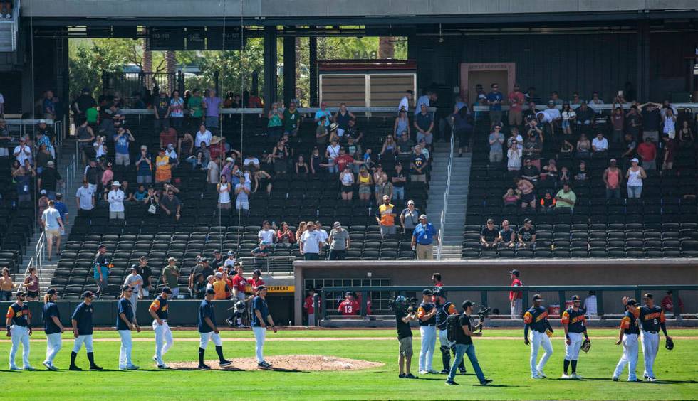 The Las Vegas Aviators walk the field after winning against the Tacoma Rainiers 3-2 in their fi ...