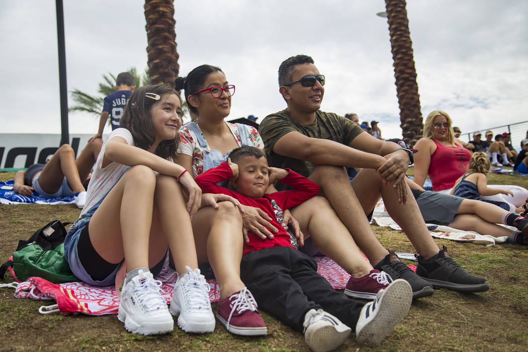 Fridas Rosas, 12, from left, watches the game with her brother Paul Mendoza, 5, and their paren ...