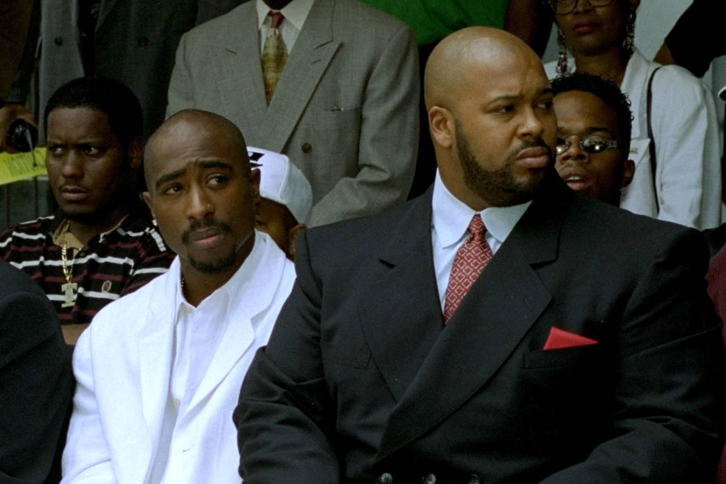 Rapper Tupac Shakur, left, and Death Row Records Chairman Marion Suge Knight, attend a voter re ...