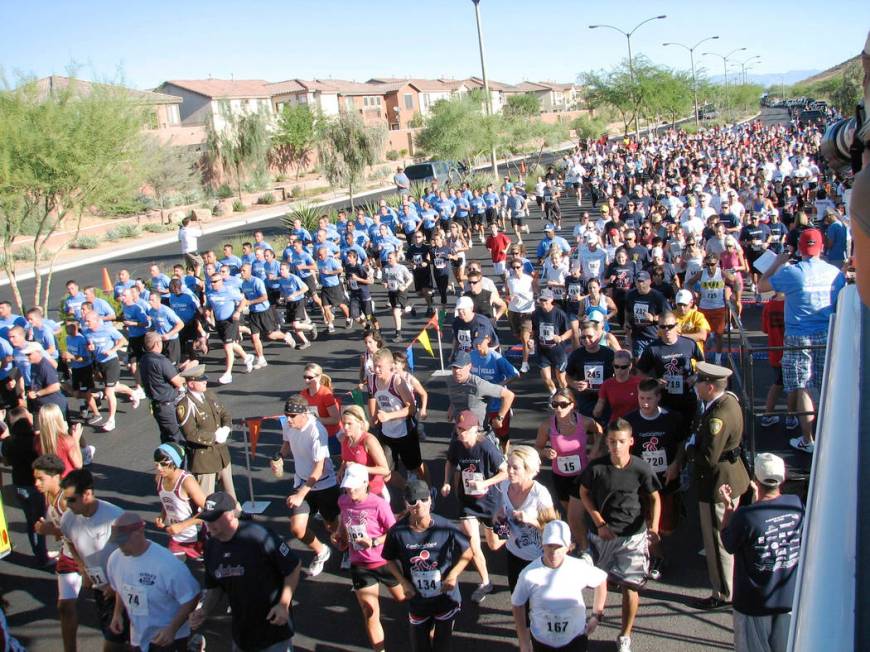 Runners give it their all in 2010's annual Candlelighters 5K and One Mile "Race for our Kids." ...