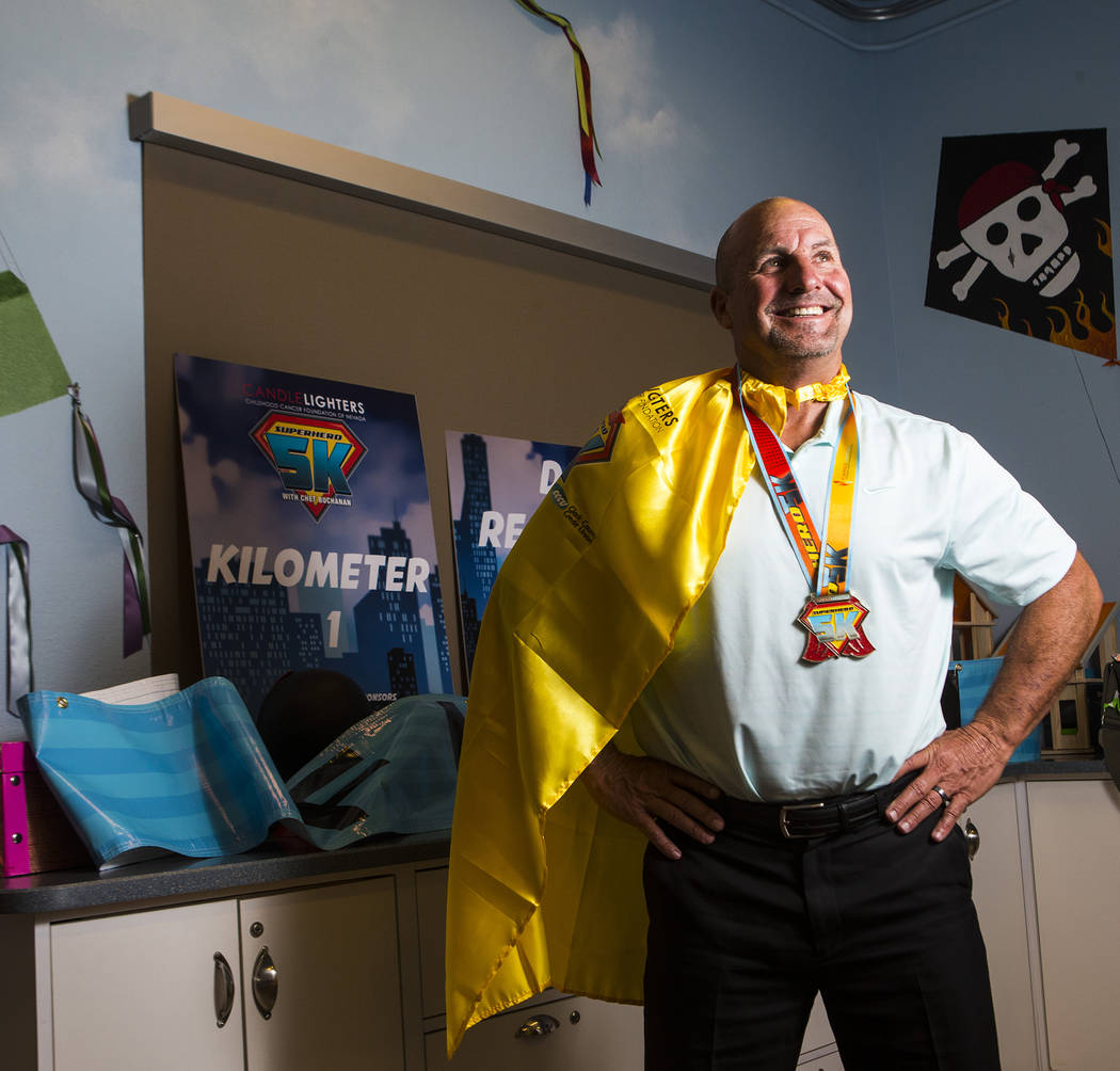 Mark Grenier, who volunteers at the Candlelighters Childhood Cancer Foundation of Nevada, poses ...