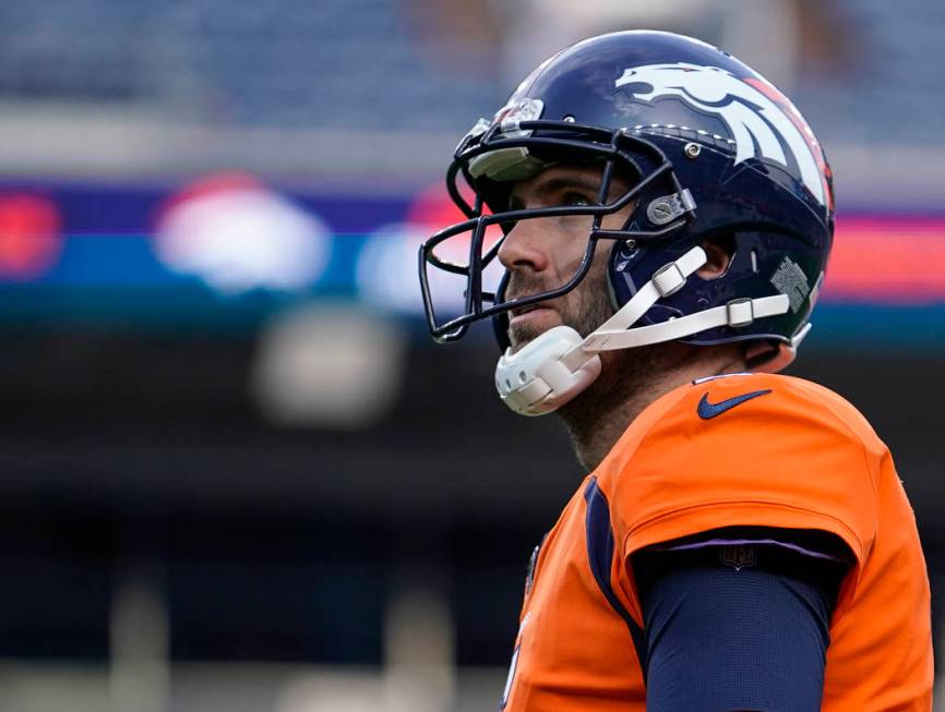 Denver Broncos quarterback Joe Flacco warms up before the start of an NFL preseason football ga ...