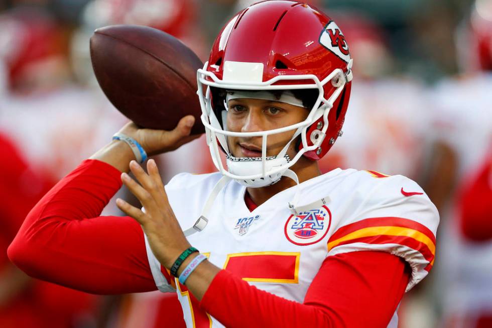 Kansas City Chiefs' Patrick Mahomes warms up before a preseason NFL football game against the G ...