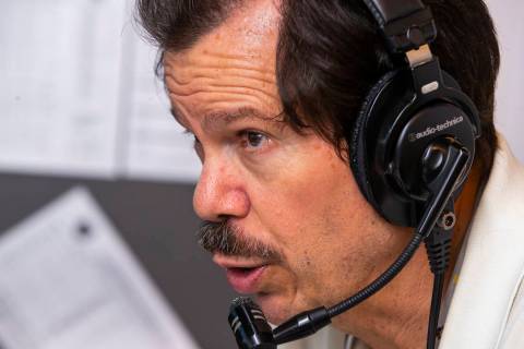 Russ Langer commentates on the play during a radio broadcast for the Las Vegas Aviators game ve ...