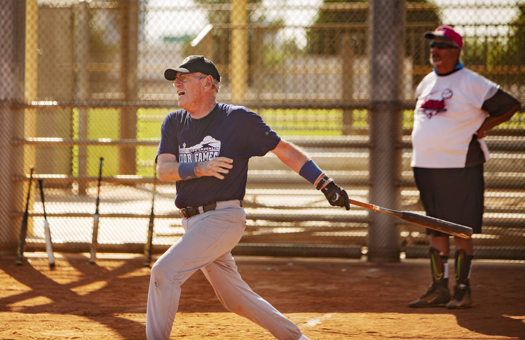 George Kuehnel, 74, prepares to go to first base, as Tony Videl, 68, background, looks on at Lo ...