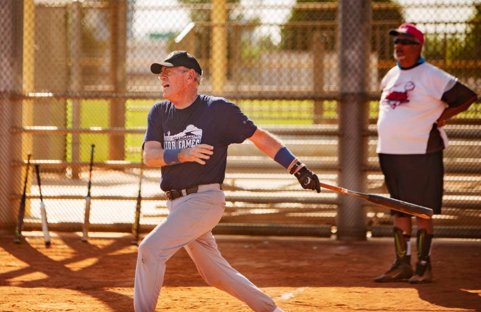 George Kuehnel, 74, prepares to go to first base, as Tony Videl, 68, background, looks on at Lo ...