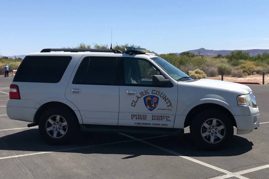 A Clark County Fire Department vehicle parked near the scene of a brush fire at Sunset Park on ...