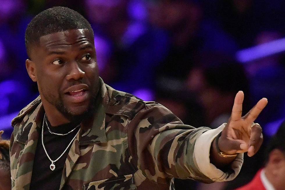 In this Jan. 29, 2019, file photo, actor Kevin Hart gestures during the second half of an NBA b ...