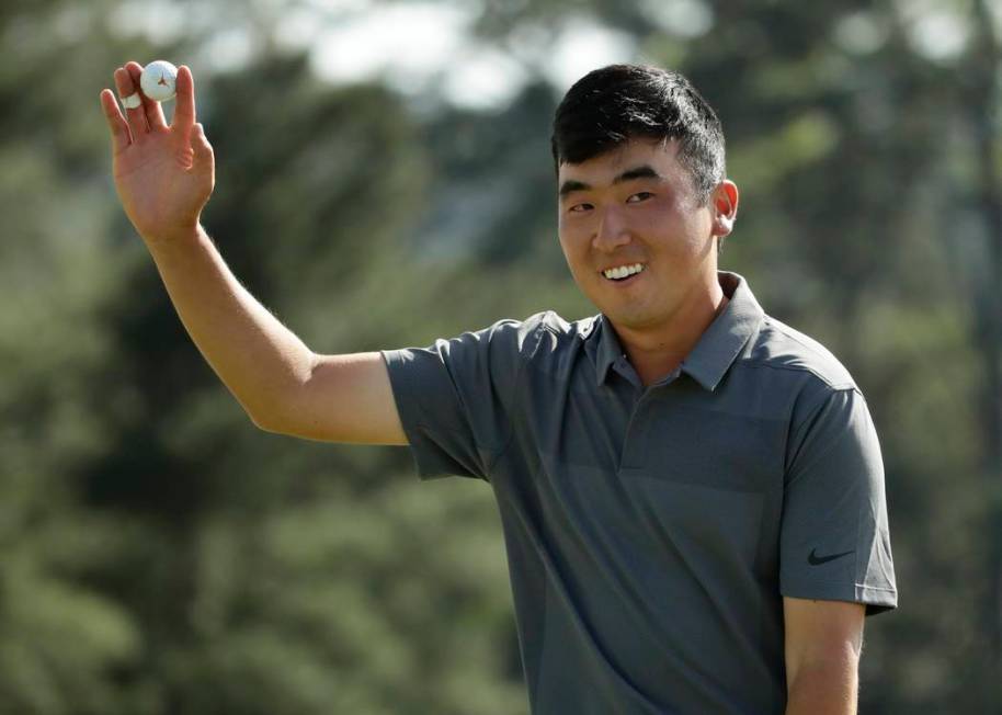 Doug Ghim reacts after his eagleon the 18th hole during the first round at the Masters golf tou ...
