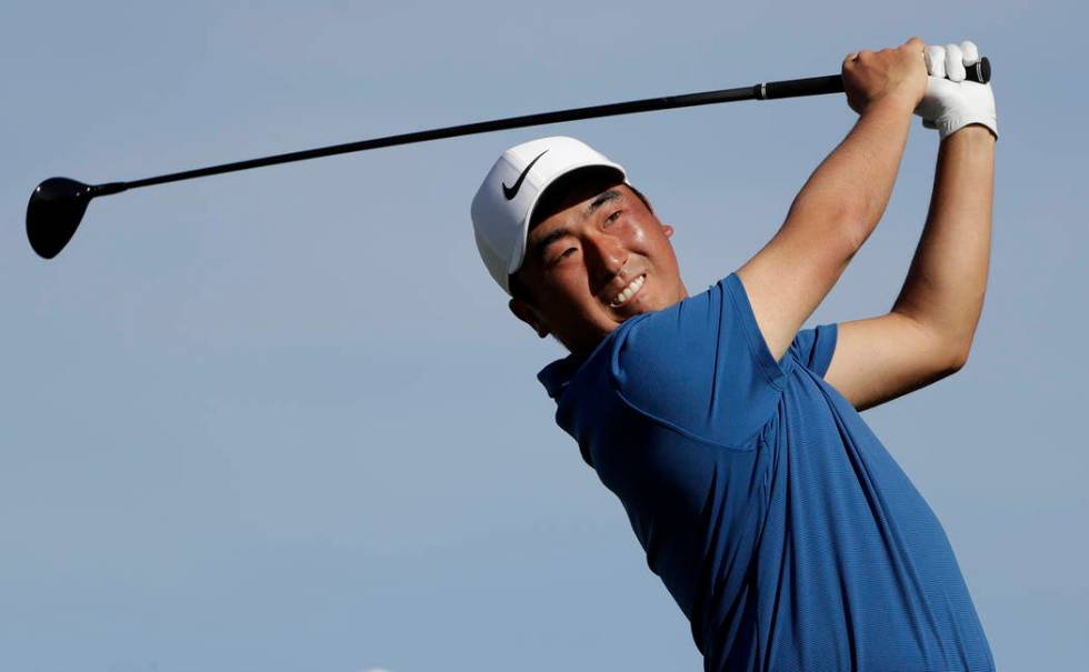 Doug Ghim watches his tee shot on the second hole of the South Course at Torrey Pines Golf Cour ...