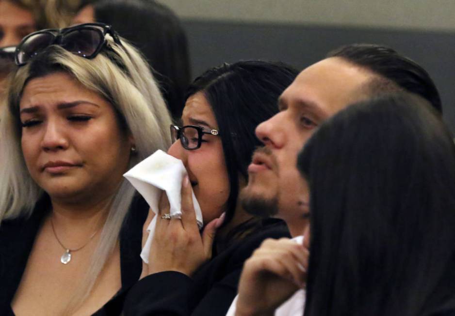 Anabel Sarabia, center, and her husband Alberto, right, parents of shooting victim 11-year-old ...