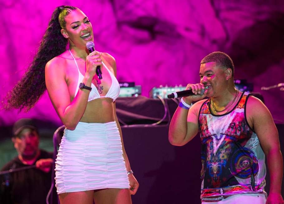 Las Vegas Aces center Liz Cambage, left, briefly walks on stage at Mandalay Bay Beach on Friday ...