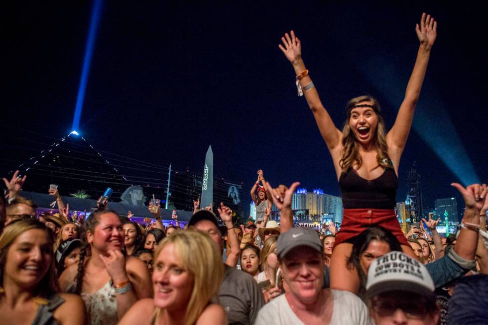 The crowd cheers as Chris Young performs during the second night of Route 91 Harvest country mu ...