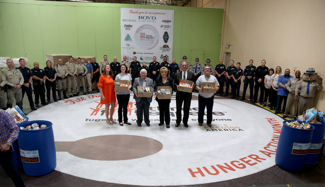 Three Square Food Bank Chief Development Officer Michelle Beck, from left, Chief Financial Offi ...