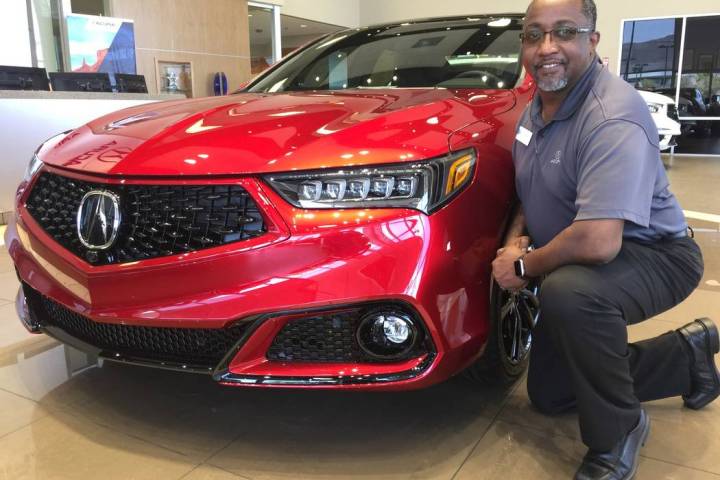 Veteran sales manager John Williams is seen with the 2020 Acura TLX PMC Edition at Findlay Acur ...