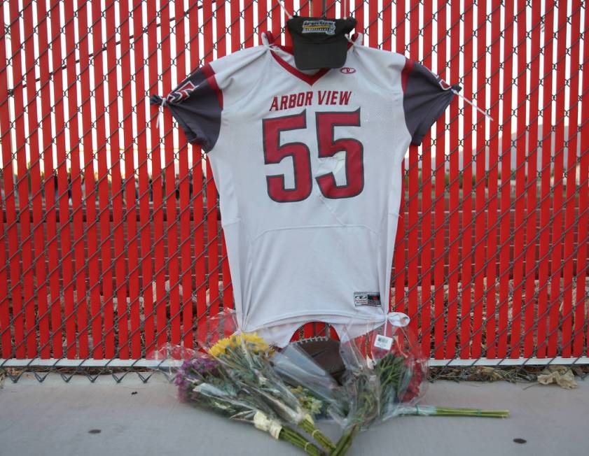 A memorial outside the Arbor View High School football field during a vigil for Malik Noshi, Ju ...