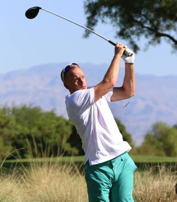 Golden Knights Nate Schmidt watches his drive during the Golden Knights charity golf tournament ...