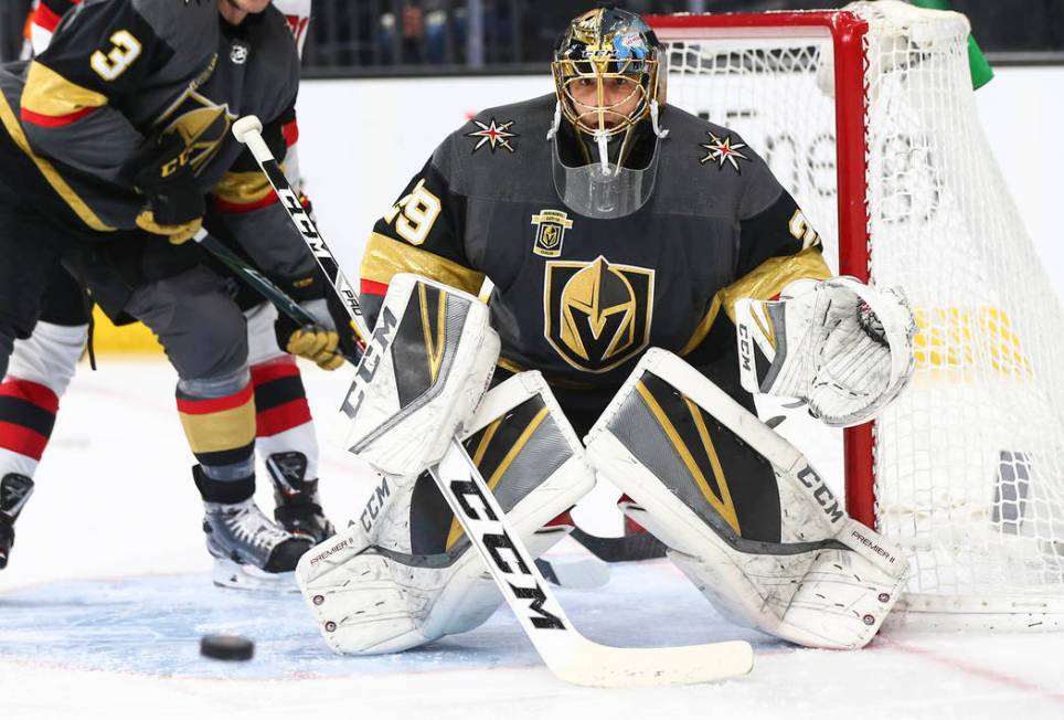 Golden Knights goaltender Marc-Andre Fleury (29) defends the goal while playing the New Jersey ...