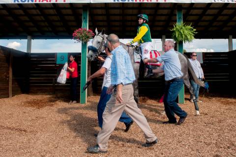 Jockey Joe Bravo and horse Real Story head to the track, Saturday, Aug. 31, 2019, for the $750, ...