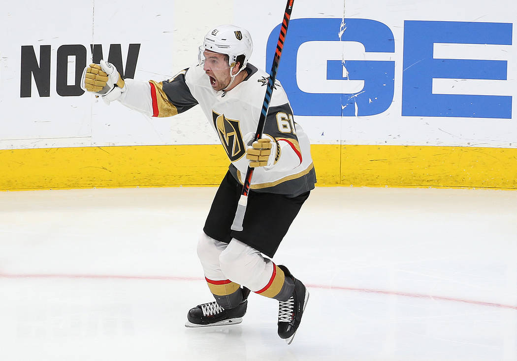 Knights right wing Mark Stone (61) celebrates after assisting Knights left wing Max Pacioretty ...