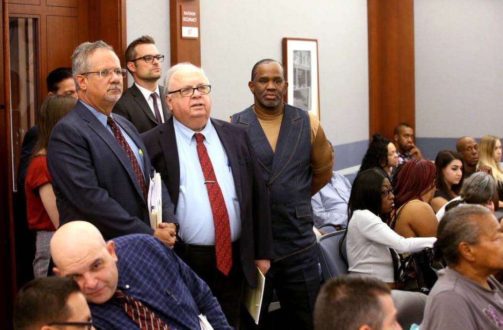 Defense attorney Ozzie Fumo, from left, his law partner Tom Pitaro and client, Ray Jefferson, a ...