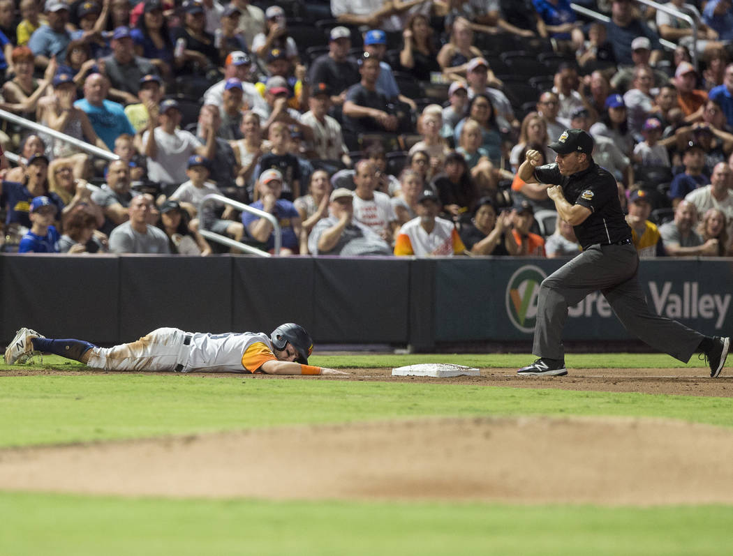 Las Vegas Aviators left fielder Mark Payton (16) is called out at third base in the bottom of t ...