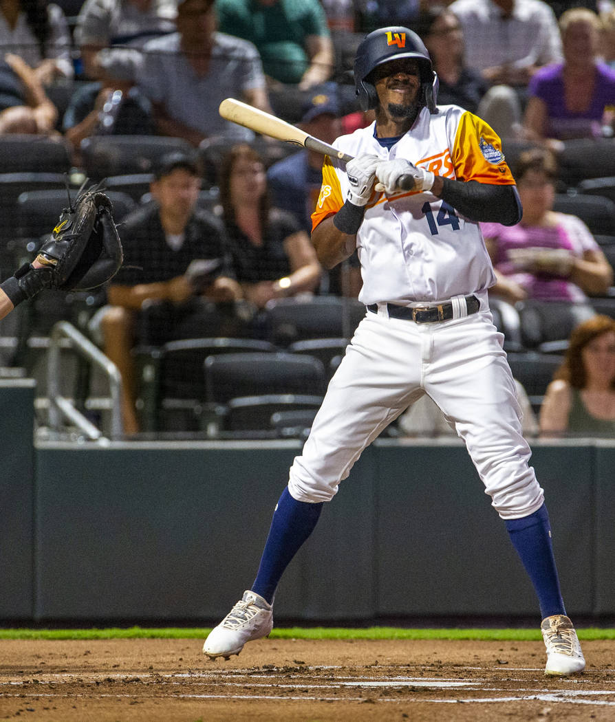 Las Vegas Aviators shortstop Jorge Mateo (14) is hit in the hand by a pitch by the Sacramento R ...