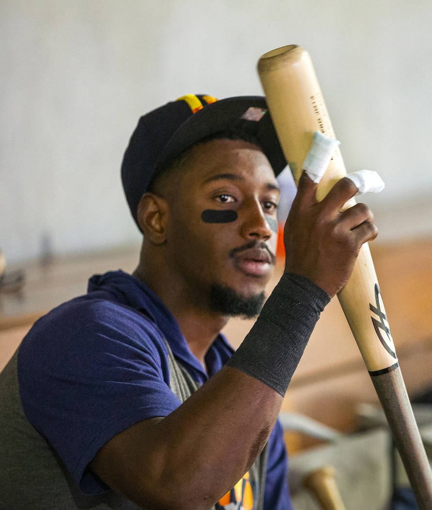 Las Vegas Aviators shortstop Jorge Mateo (14) attempts to grip a bat with fingers wrapped after ...