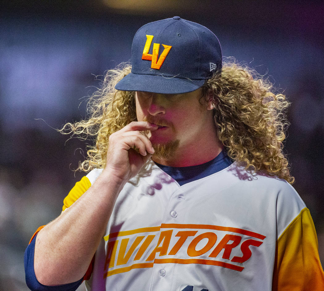 Las Vegas Aviators pitcher Grant Holmes (11) bites a nail on his way to the dugout versus the S ...