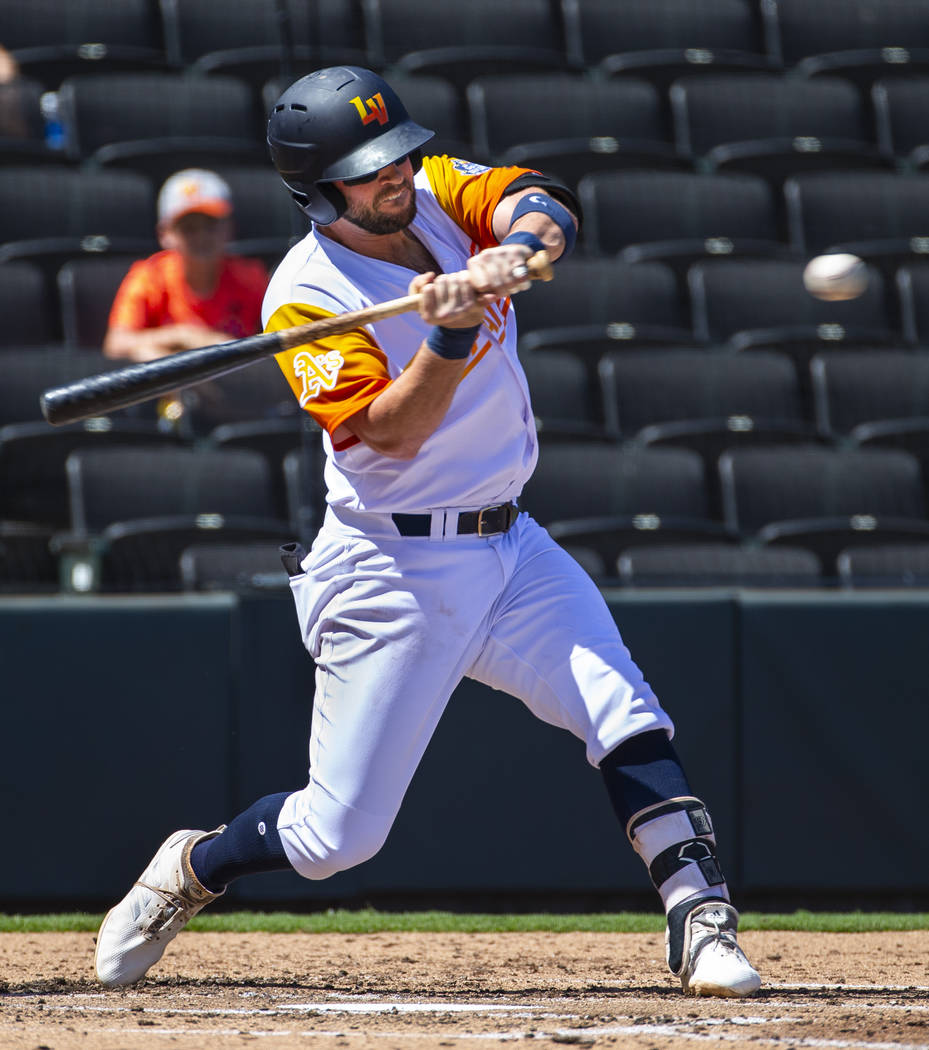 Las Vegas Aviators third baseman Mikey White (4) eyes a pitch at the plate in the first inning ...