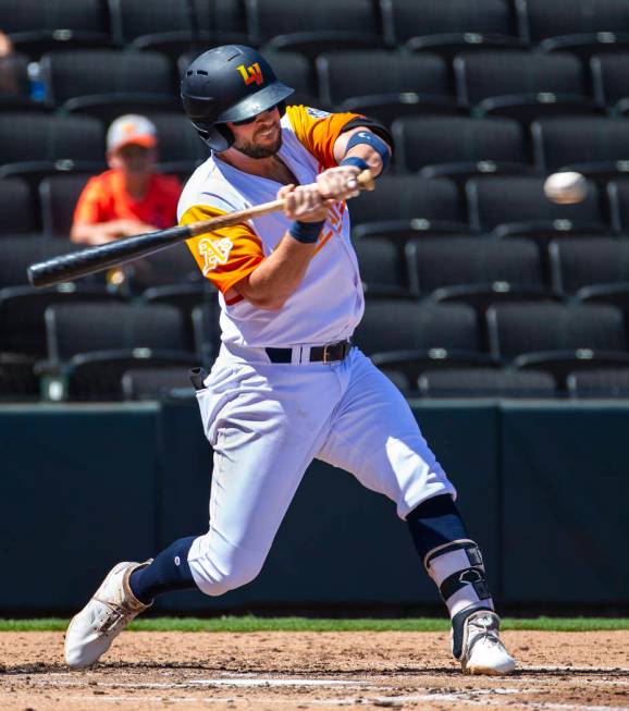Las Vegas Aviators third baseman Mikey White (4) eyes a pitch at the plate in the first inning ...