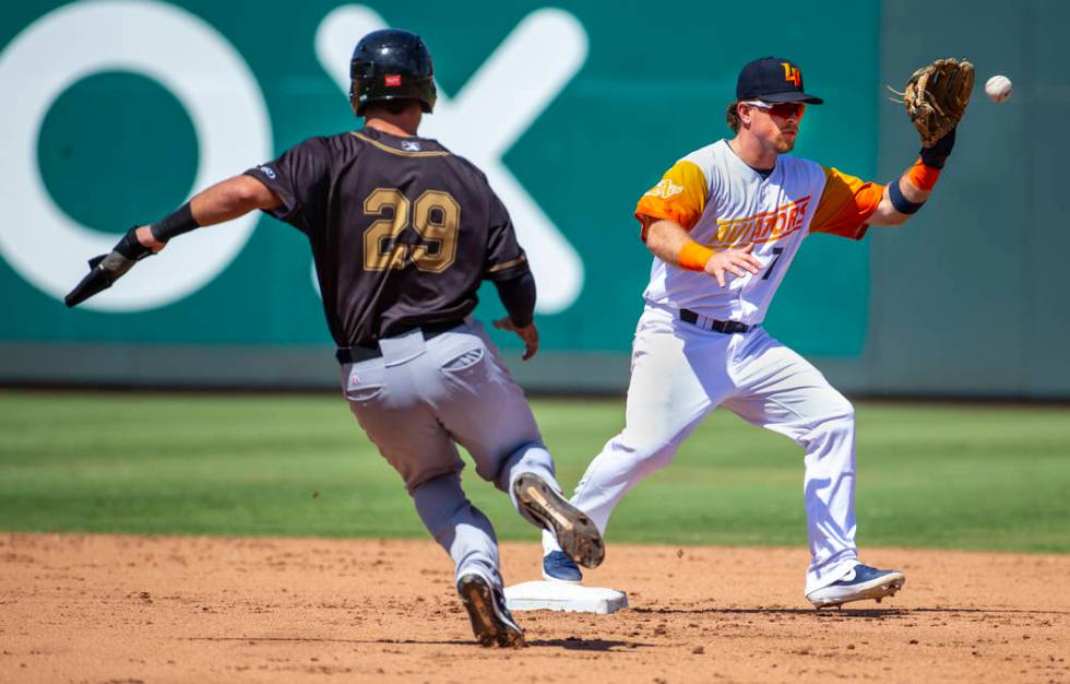 Las Vegas Aviators second baseman Trace Loehr (7, right) readies to make the out in the fourth ...