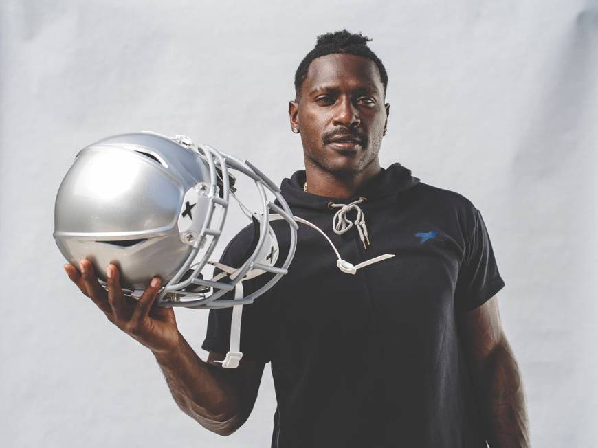 Raiders wide receiver Antonio Brown holds his new helmet, the Shadow by helmet-maker Xenith. Ph ...