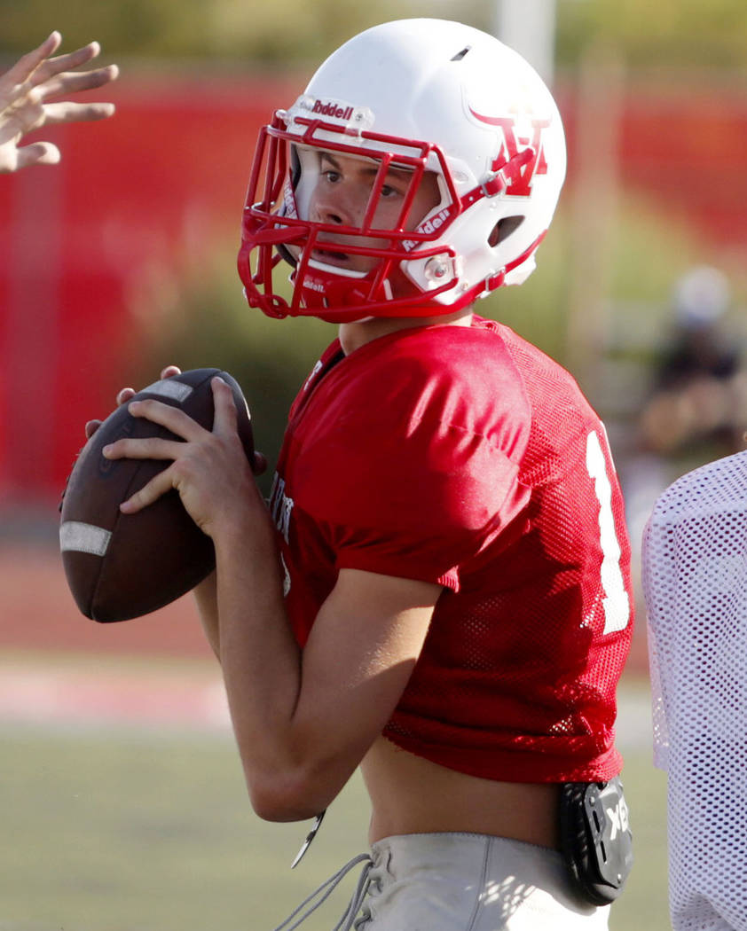 Arbor View's varsity quarterback Kyle Holmes (17), runs drills during practice at Arbor View Hi ...