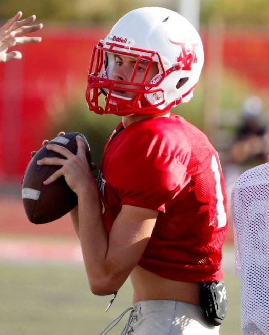 Arbor View's varsity quarterback Kyle Holmes (17), runs drills during practice at Arbor View Hi ...