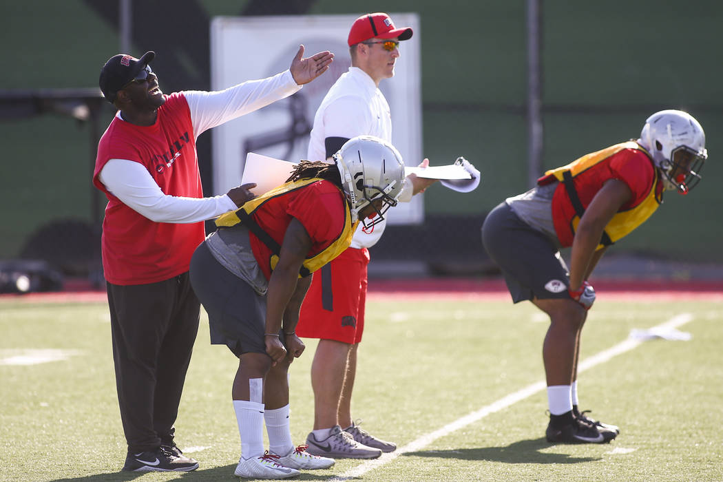 UNLV Rebels defensive coordinator Tim Skipper, left, during football practice at Rebel Park in ...