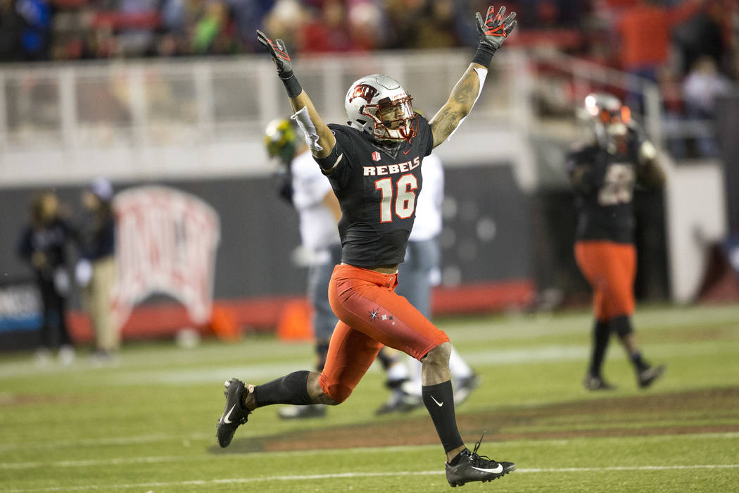 UNLV Rebels linebacker Javin White (16) celebrates his interceptions against the Nevada Wolf Pa ...