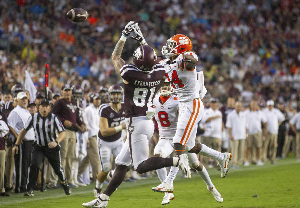 Clemson safety Denzel Johnson (14) knocks away a pass intended for Texas A&M tight end Jace ...