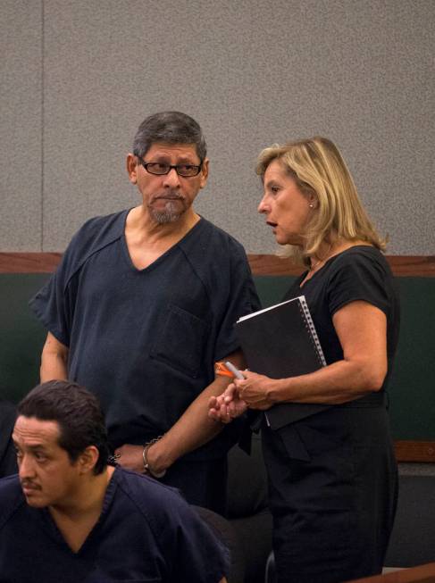 Jose Azucena, left, listens to District Judge Richard Scotti through a Spanish language interpr ...