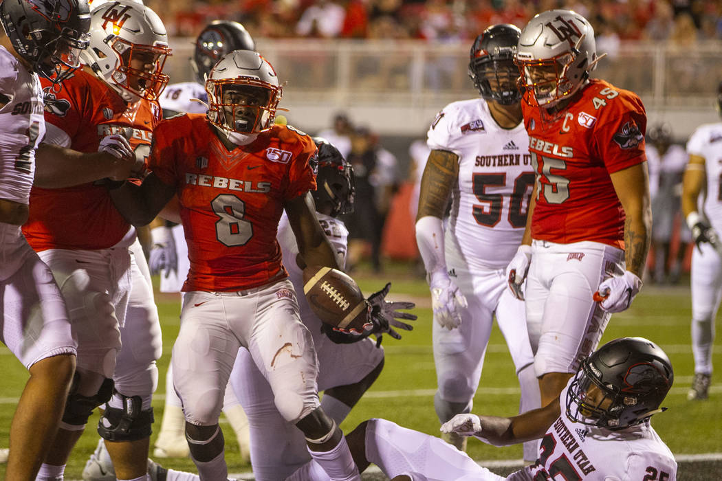 UNLV Rebels running back Charles Williams (8) celebrates a touchdown over Southern Utah at Sam ...