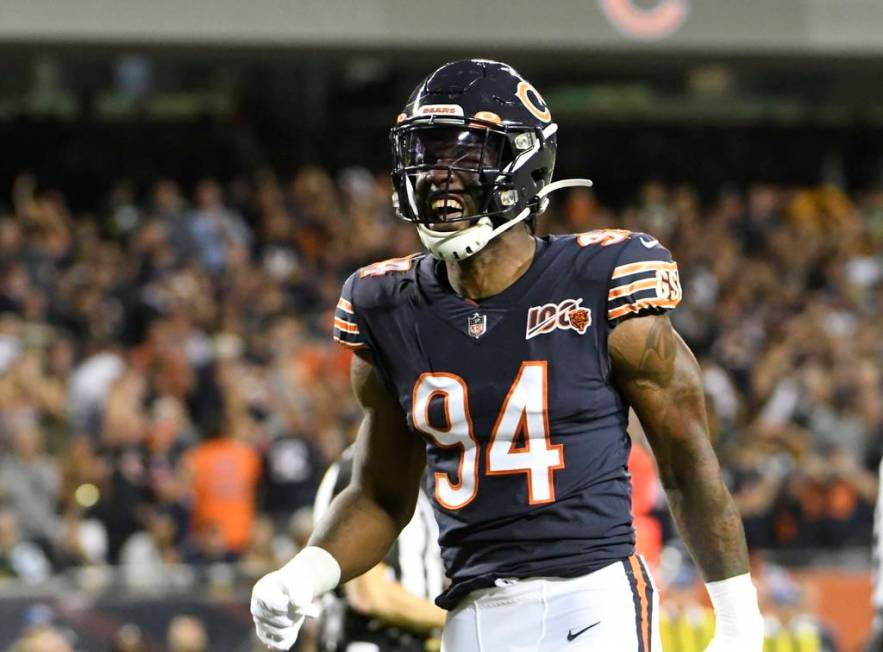 Chicago Bears' Leonard Floyd reacts after sacking Green Bay Packers' Aaron Rodgers during the f ...