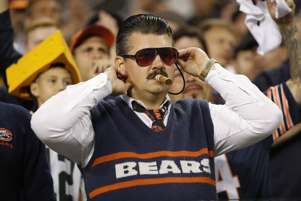 A fan watches during the first half of an NFL football game between the Green Bay Packers and t ...