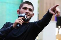 Russian UFC fighter Khabib Nurmagomedov gestures to the crowd during an open training session a ...