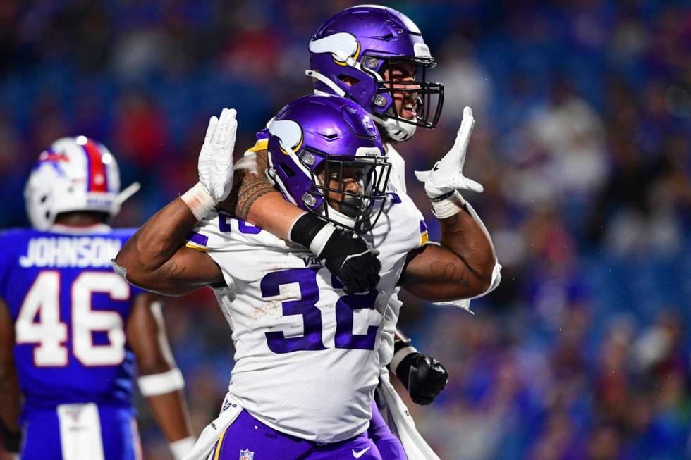 Minnesota Vikings running back De'Angelo Henderson (32) celebrates his touchdown with offensive ...