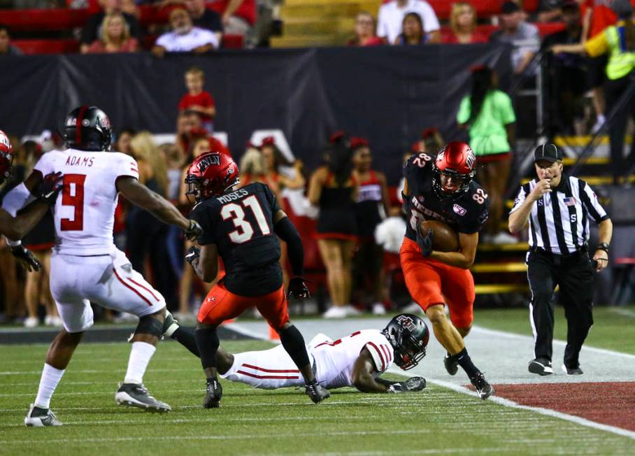 UNLV Rebels quarterback Armani Rogers (1) throws a pass during the first half of an NCAA footba ...