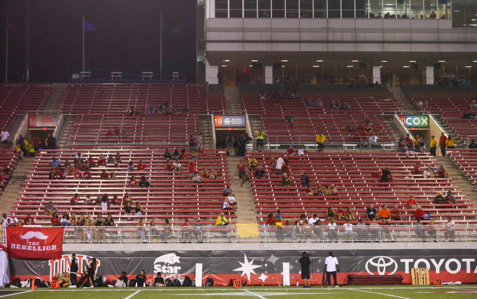 UNLV Rebels fans leave the game during the second half of an NCAA football game against the Ark ...