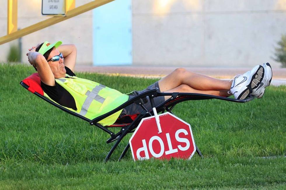 Dennis Noel of Las Vegas, a crossing guard, relaxes as he waits to assist Elise Wolff Elementar ...