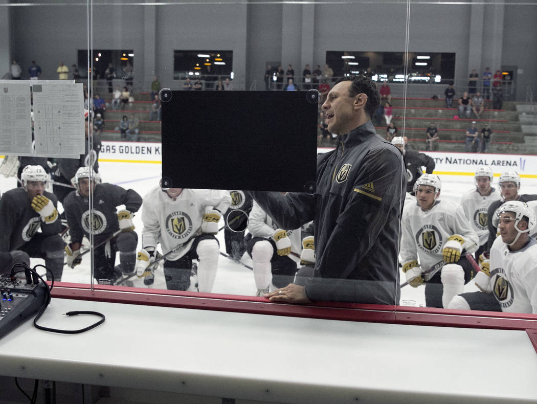 Chicago Wolves coach Rocky Thompson lays out a practice plan for the Vegas Golden Knights durin ...