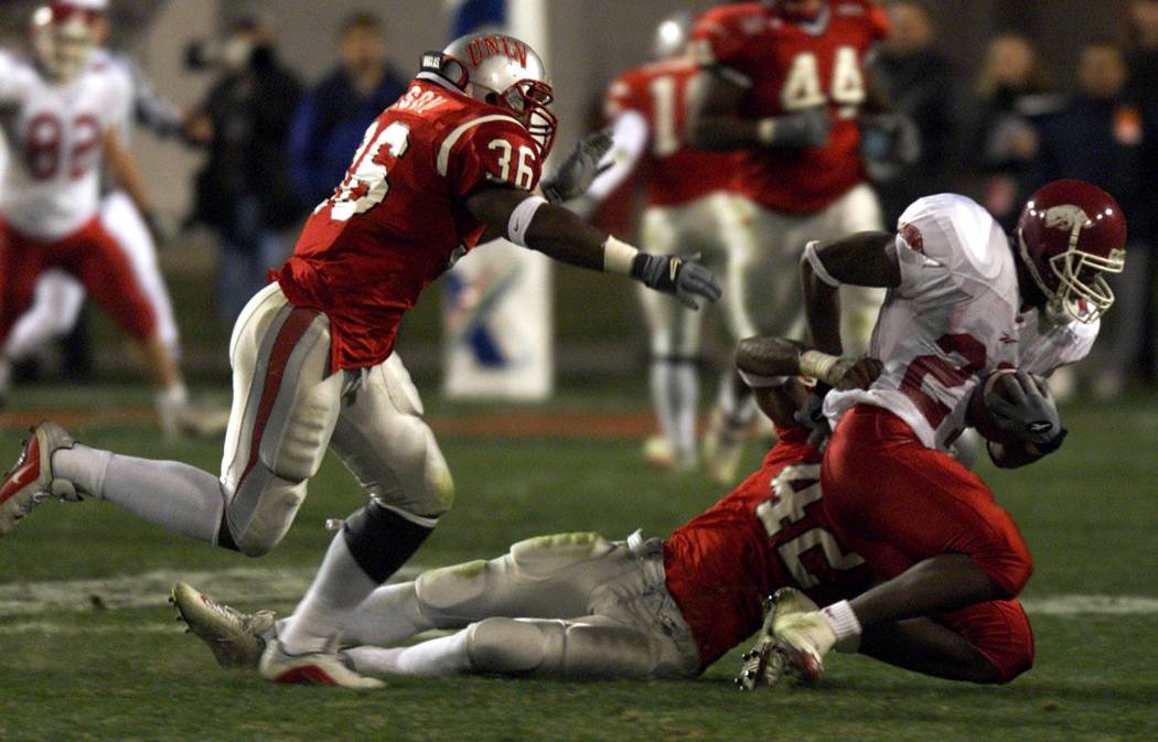 UNLV strong safety Sam Brandon (42) takes down University of Arkansas (roster says his position ...